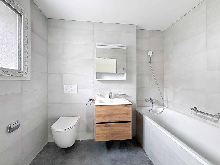 Appartement de 3.5 pièces neuf au rez-de-chaussée avec terrasse